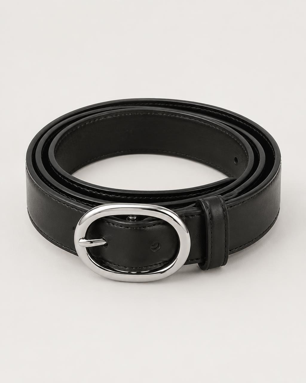 The Essential Belt in black leather with oval silver buckle